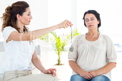 Therapist hypnotizing her patient