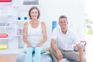 Doctor and patient smiling at camera