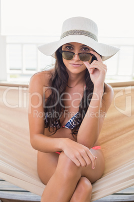 Pretty brunette relaxing on a hammock