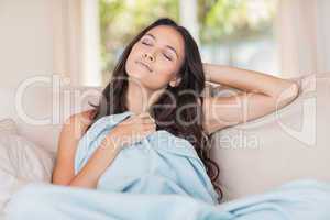 Pretty brunette relaxing on the couch