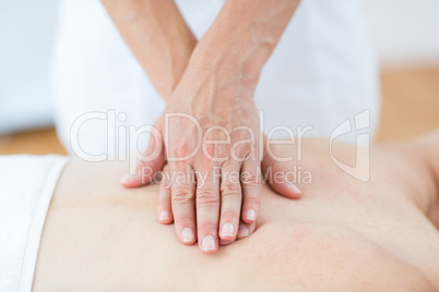 Physiotherapist doing back massage