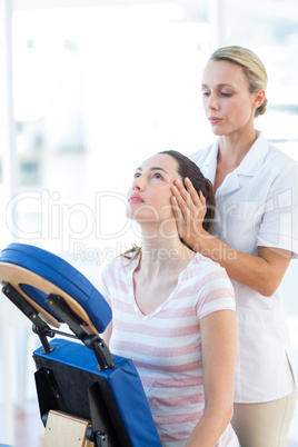 Woman having neck massage