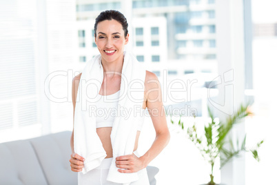 Brunette standing with towel