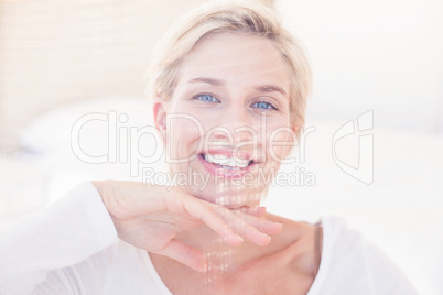 Smiling blonde woman looking at camera