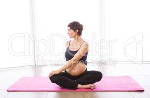 Pregnant woman keeping in shape