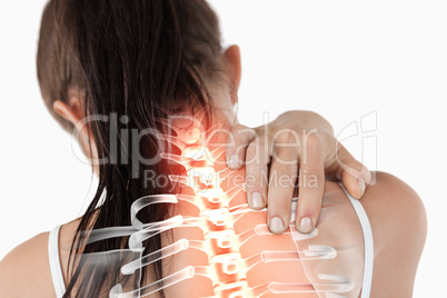 Highlighted spine of woman with neck pain