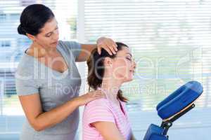 Woman having neck massage