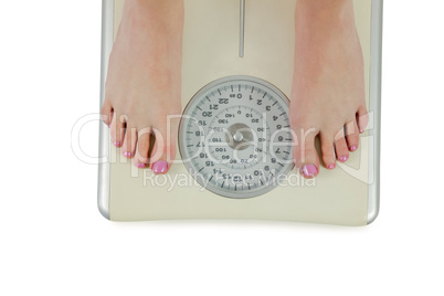 Woman standing on scales
