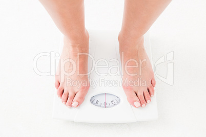 Womans feet on scales