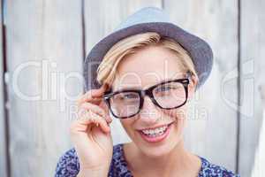 Pretty blonde woman wearing hipster glasses