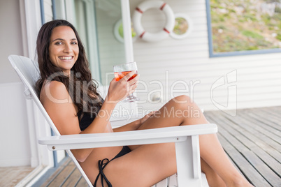 Beautiful woman relaxing and holding drink