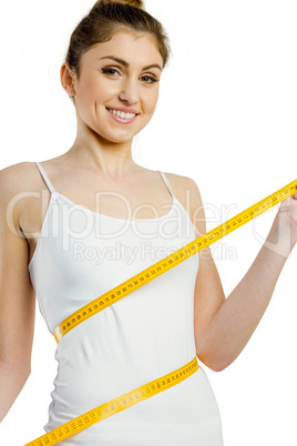 Slim woman measuring her waist