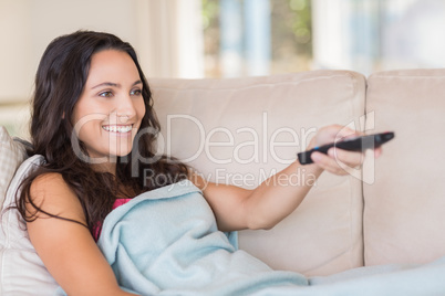 Pretty brunette relaxing on the couch