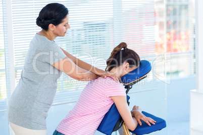 Woman having shoulders massage