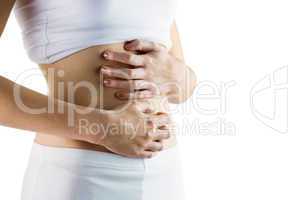 Slim woman touching her belly