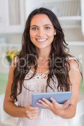 Beautiful brunette using tablet pc