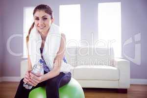 Fit woman with towel and water bottle