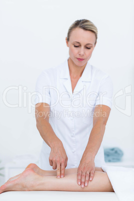 Physiotherapist doing leg massage