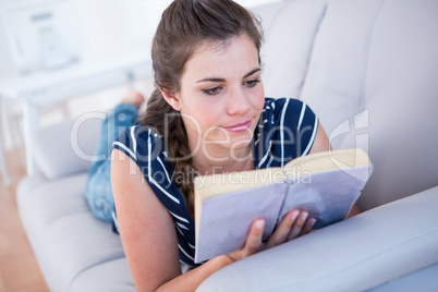 Focused woman reading a book