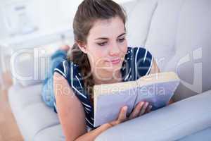 Focused woman reading a book