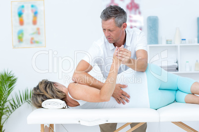 Doctor massaging his patient back