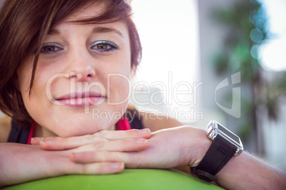 Fit woman leaning on exercise ball