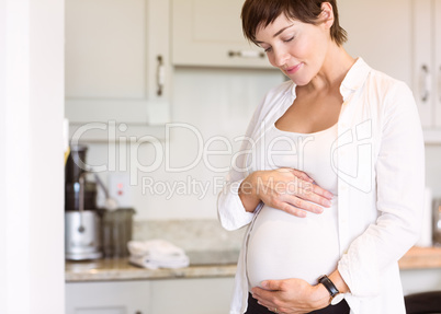 Pregnant woman holding her bump