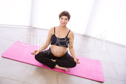 Pregnant woman keeping in shape Pregnant woman keeping in shape