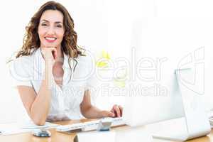 Smiling businesswoman working with her computer