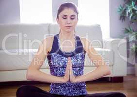 Fit woman doing yoga on mat