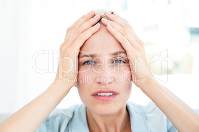 Blonde woman having headache