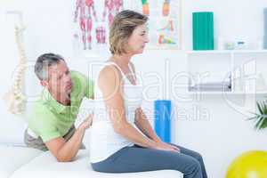 Doctor examining his patient back