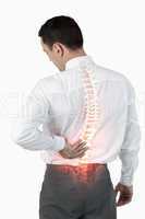 Highlighted spine of man with back pain