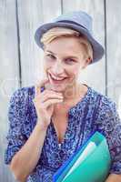 Pretty blonde woman holding folders