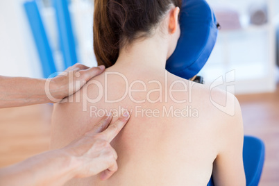 Woman having back massage