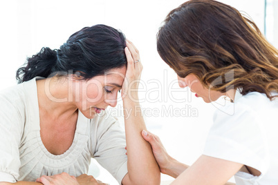 Therapist comforting her patient