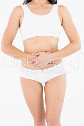 Fit woman suffering stomach pain