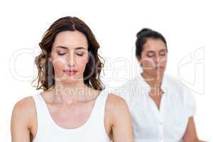 Women sitting in lotus pose