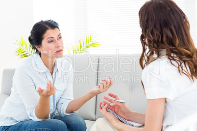 Depressed woman talking with her therapist