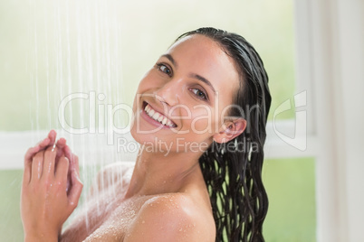 Pretty brunette taking a shower