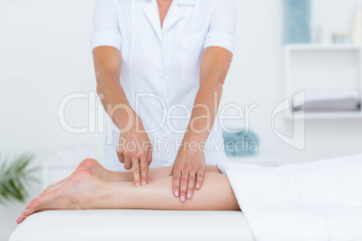 Physiotherapist doing leg massage