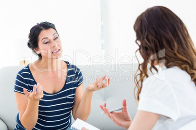 Depressed woman talking with her therapist