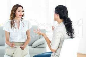 Depressed woman talking to her therapist