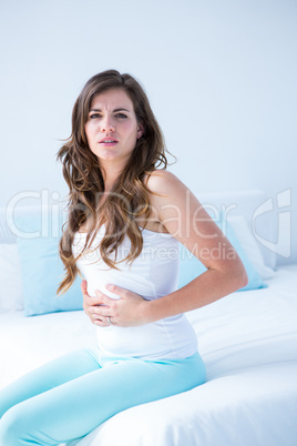 Attractive woman with stomach pain