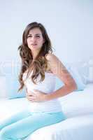 Attractive woman with stomach pain