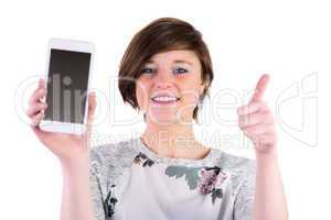 Pretty brunette holding her smartphone and looking at camera