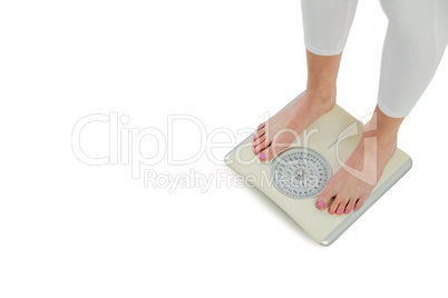 Woman standing on scales