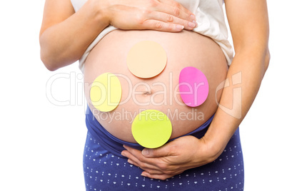 Pregnant woman with stickers on bump