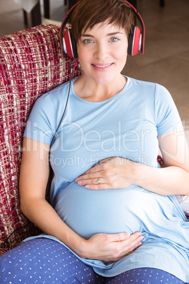 Pregnant woman listening to music