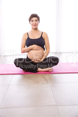 Pregnant woman keeping in shape